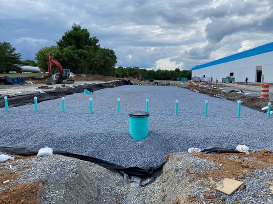 Backfilling an underground pond for an industrial site.