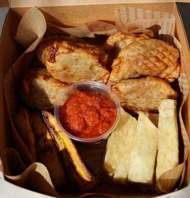 Combo box: banana fritters, fried yams, roasted plantains with tomato and onion sauce