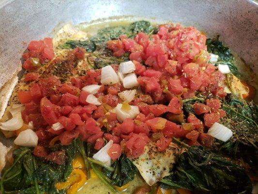 Sauteed cod with tomato, onion, spinach and veggies