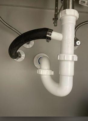 Condensate drain uses gravity to drain the water properly. The condensate line (black hose) is traveling upward instead of downwards.