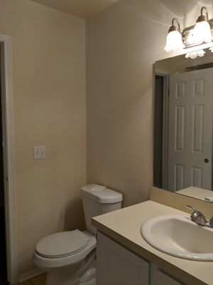 New toilet, vanity, sink and faucet, light. -- at Jacksonville FL