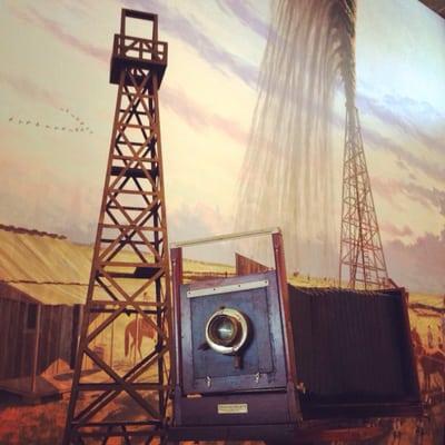 Antique camera in front of the largest indoor mural in Texas