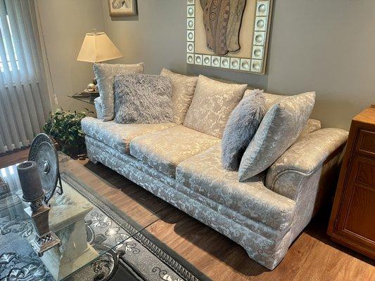 Upholstery - Reupholstered in a gorgeous paisley. The fabric picks up on the silver hints in the room. Absolutely stunning!