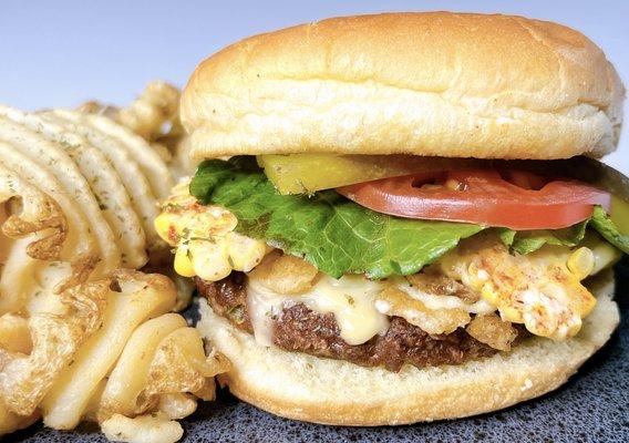 Plant-based patty seasoned to perfection topped topped with vegan nacho cheese,  crispy jalapenos and street corn with the fixings