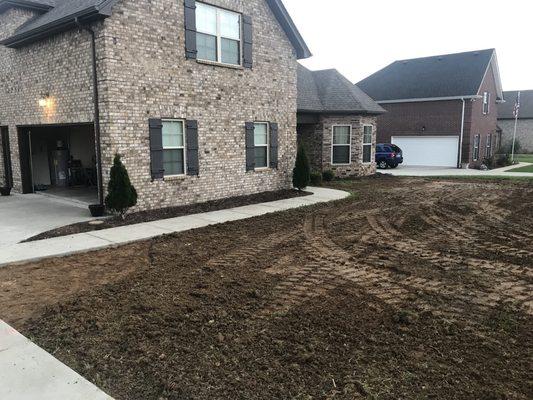 Regrading the yard process. Took about two truckloads of dirt.