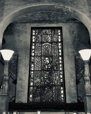 Large stained glass window of Jesus in Trinity's sanctuary. (E. Daum)