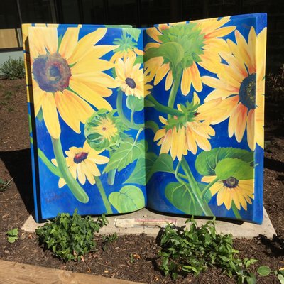 Painted book located outside of the library