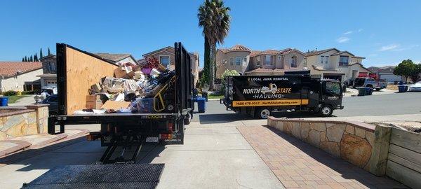 Junk Removal and Hauling. House cleanout in progress before a big move. Two trucks on site!