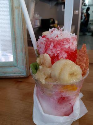 cholada made with crushed ice, fresh fruit slices and shredded coconut