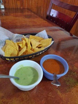 Complimentary chips w/2 sauces. The green sauce is DELISH. Spicy with hints of avocado and cilantro.