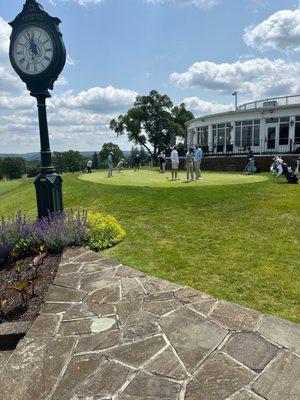 The Sunnehanna CC practice green and clubhouse