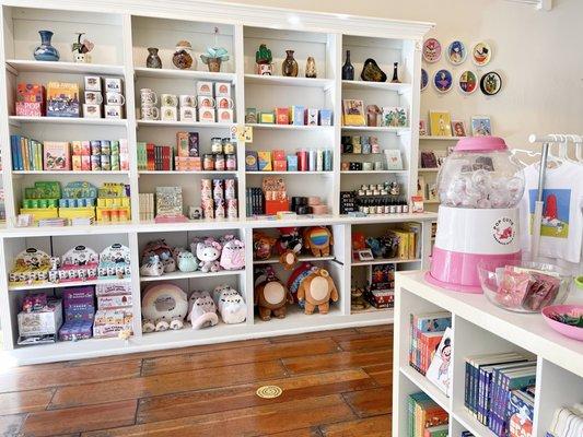 Shelves full of home decor, self care (candles, room sprays, decks), collectible blind boxes + plush, etc.