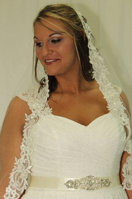 A head band wedding veil ivory in color