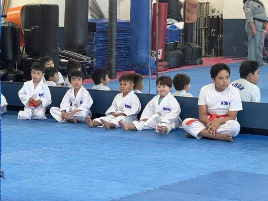 How cute are the uniforms! This is the white to red belt class.