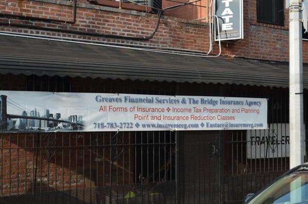 The office banner on the fence outside our office. (Photo by Eustace Greaves Jr)