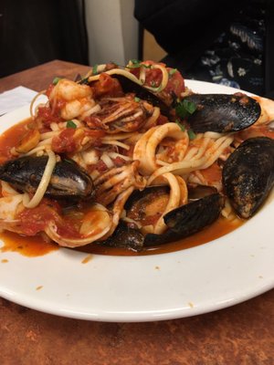 Seafood over spaghetti