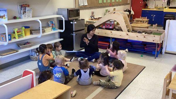 Singing the "who came to school today" song with Ms. Carmen