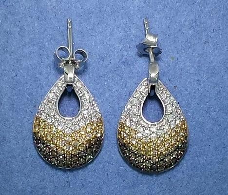 Beautiful white gold earrings. Colorless, cannery, and chocolate diamonds.