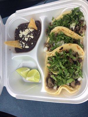 3 carne asada tacos with side of beans