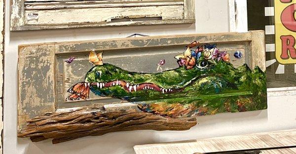 Gator and Butterflies painted on a reclaimed door with driftwood from the Mississippi River. Original by local artist, Paige DeBell.