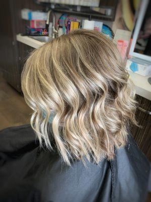 Neutral Blonde Balayage with heavy face framing and an A-line cut by Angela.