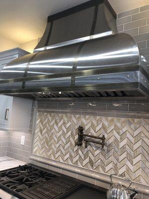 Custom stainless and antiqued brass hood