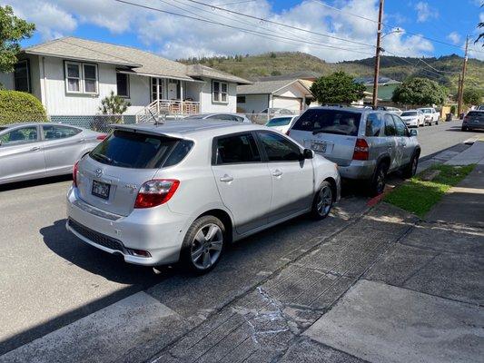 2011 Toyota Matrix bumper has deep scratches and damage to both sides.