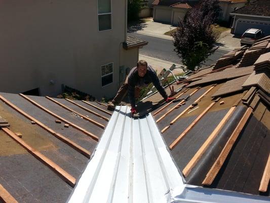 replacing tiles after installing upgraded valley metal