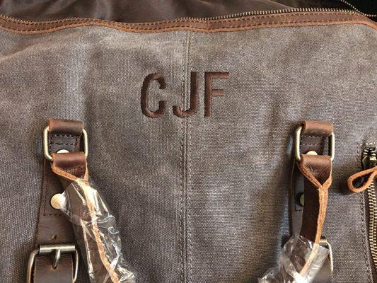 Mike did an amazing job putting the initials on this thick canvas duffle bag!