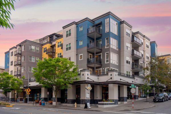 Exterior of apartment building at twilight.