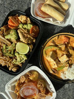 Pad see ew, red curry tofu, crab rangoons, spring rolls