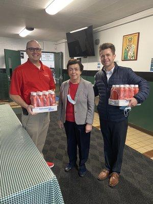 Donating State Farm water bottles to St. Patrick's School