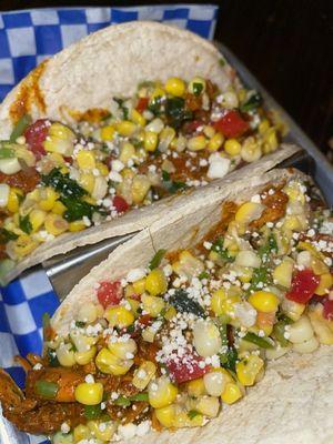 Dos Pollo - Grilled chicken tacos on corn tortillas with grilled corn salsa and avocado crema