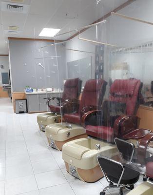 All patrons are separated from the nail techs and each other by large plastic panels