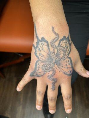 Amazing butterfly hand tattoo