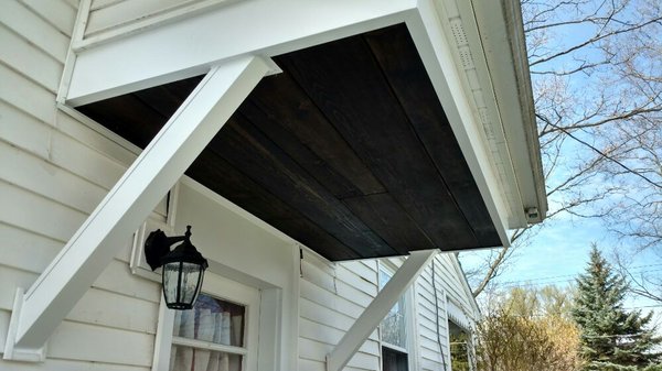 Refinished soffit, posts and fascia wrapped in aluminum