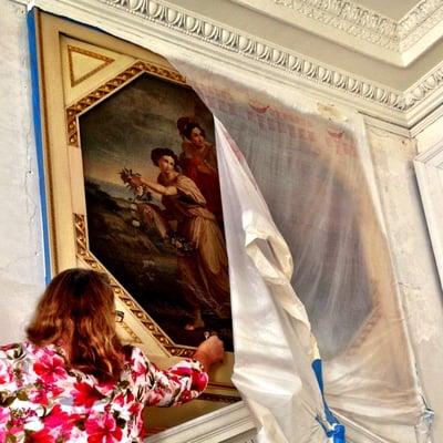 An on-site inspection of paintings to determine the best method by which to clean and restore them.