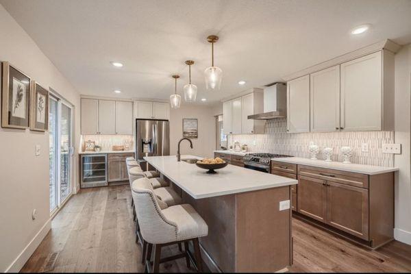 Wood floors, designer cabinets finished off with quartz countertops and beautiful backsplash.  We have you covered.