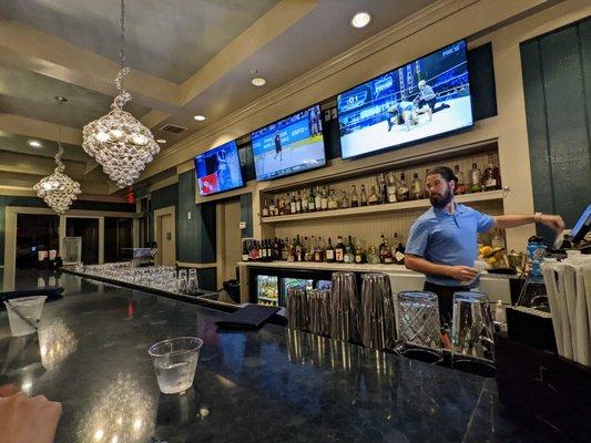 Inside. The bar. And our bartender. Nice guy. Great service.