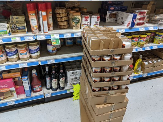 Memorial candles on sale, hidden by other candles that aren't on sale. I had to move the boxes over to reach them.