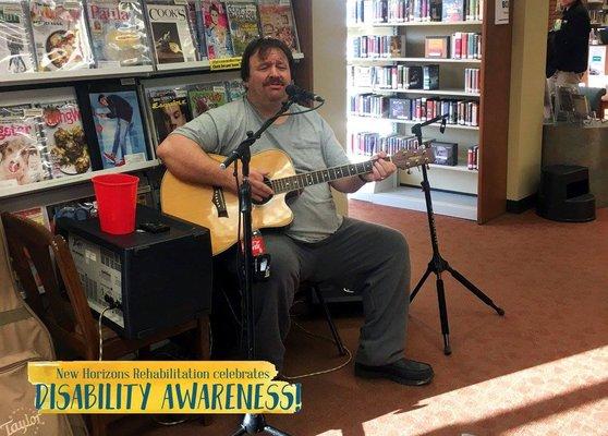 Live entertainment provided by a client during Disability Awareness Month festivities.