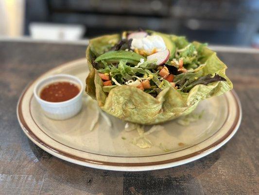 Taco salad on a spinach tortilla bowl