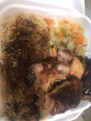 Jerk chicken with gravy on the rice & cabbage