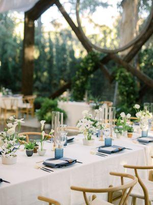 A mix of Boho Babe centerpieces and bud vases