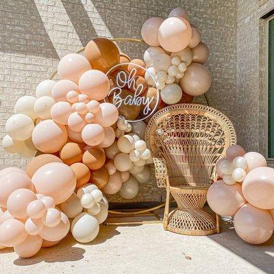 Extra thick garland with a neon sign and peacock chair