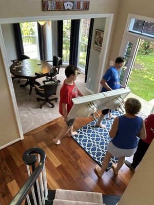 Son and grandson carrying out the old marble top.