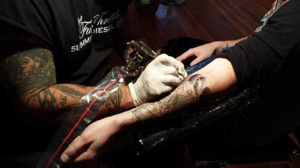 Mikey getting ink done by Scott Musick