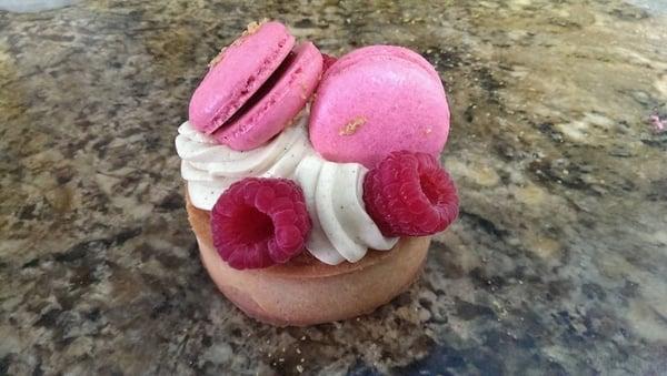 Raspberry macaron, pistacchio mousse line cream, fresh raspberry.