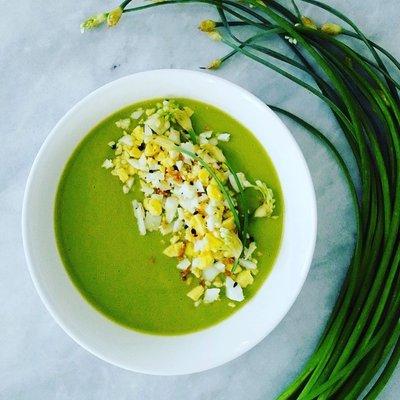 Wild garlic and asparagus soup with chopped eggs