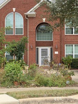 Custom arch top single hung windows with grids.